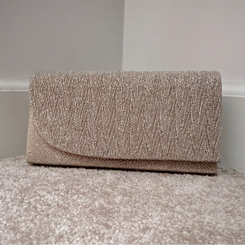 Gold glitter clutch with strap.